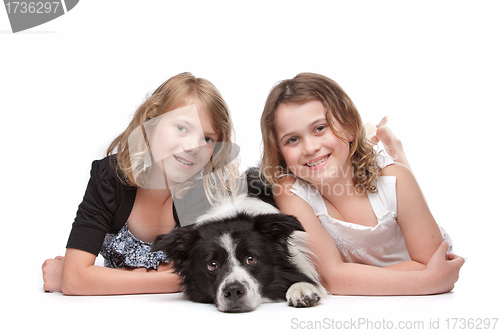 Image of Two girls and a dog