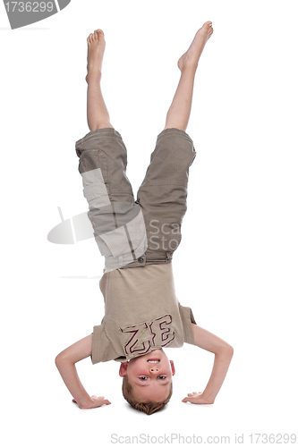 Image of little boy standing on hands