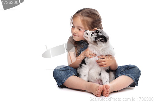 Image of little girl and a puppy