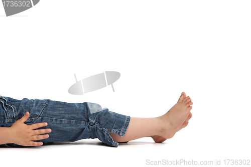 Image of little girl lying on back