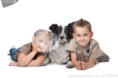 Image of Two kids and a dog