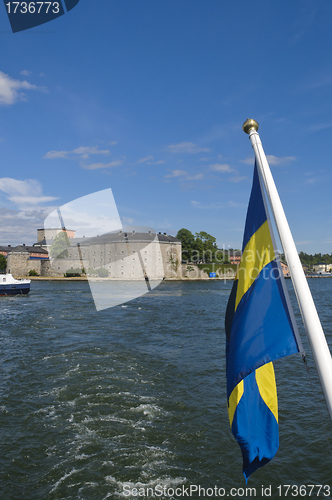 Image of Vaxholm fortress and Swedish flag, Stockholm archipelago, Sweden