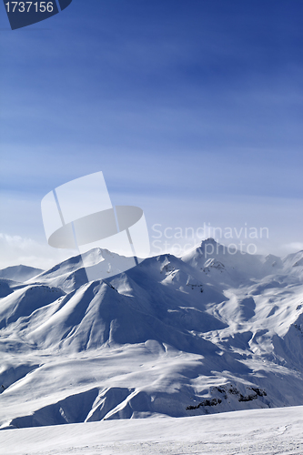 Image of Snowy mountains and blue sky
