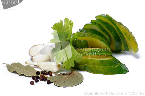 Image of Slices of Pickled cucumbers and spices