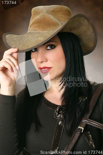 Image of Beautiful cowgirl wearing hat