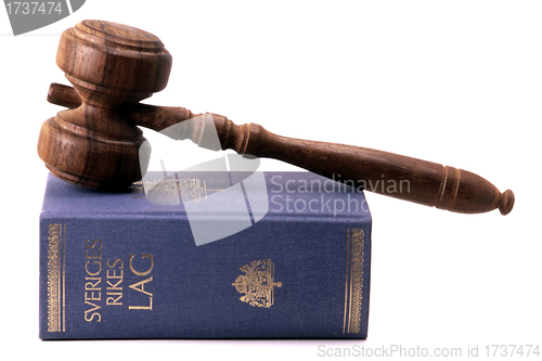 Image of Old gavel and Swedish law book
