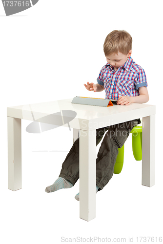 Image of boy with a Tablet PC on the desk