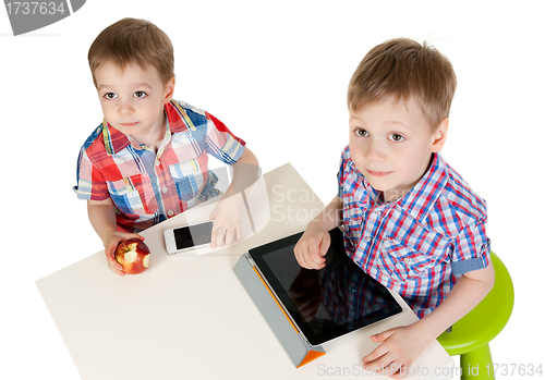 Image of Two brothers with a Tablet PC