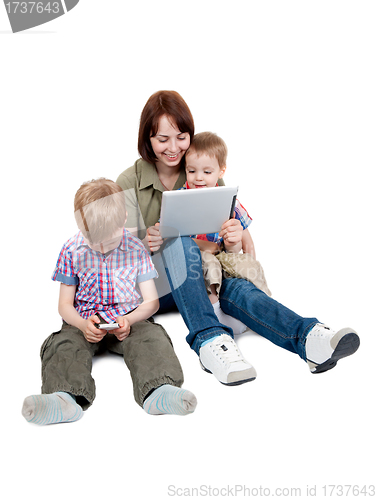 Image of mother with two sons and Tablet Computer