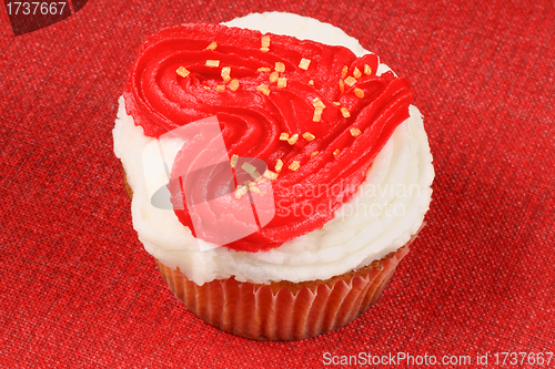 Image of Valentine's day cupcake over red background