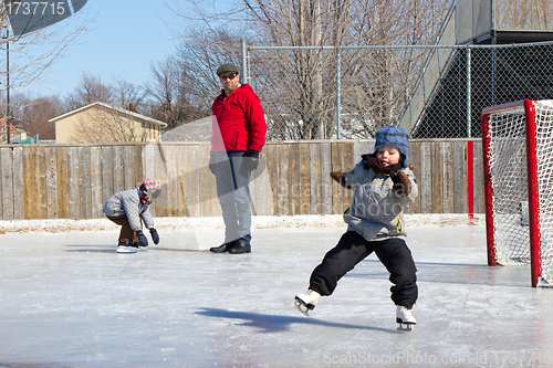 Image of Family at a skating rink