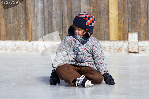 Image of Boy learning to ice skate