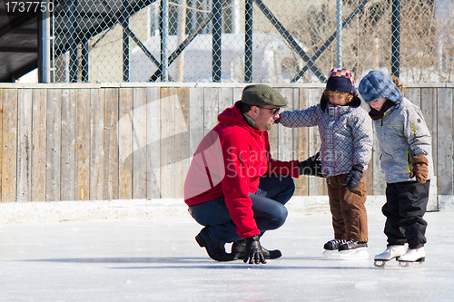 Image of Family having fun at the skating rink