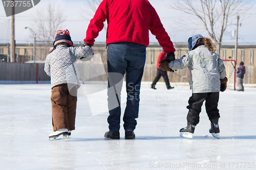 Image of Family having fun at the skating rink