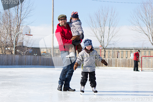 Image of Happy family at the skating rink