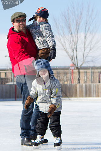 Image of Happy family at the skating rink