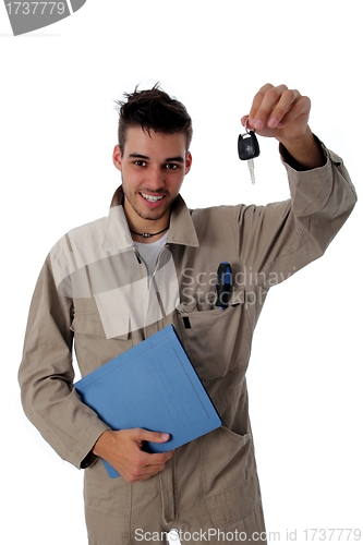 Image of Friendly mechanic holding up car keys