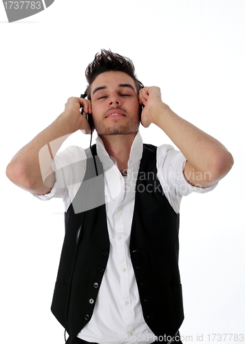 Image of Young man enraptured by his music