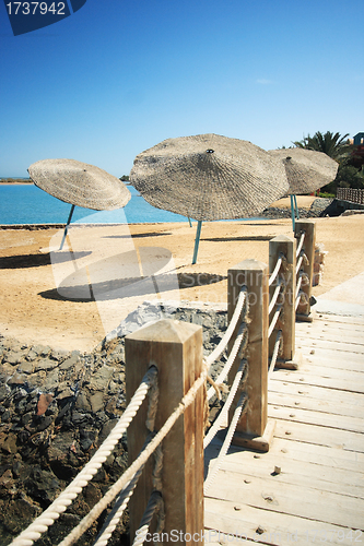 Image of Sea with sun umbrella