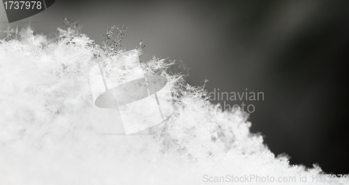 Image of snowflake in white snow