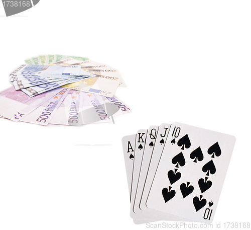 Image of Playing cards and money on white