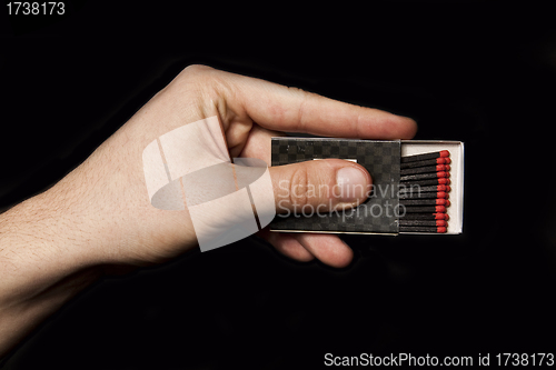 Image of Box of matches in the man hand