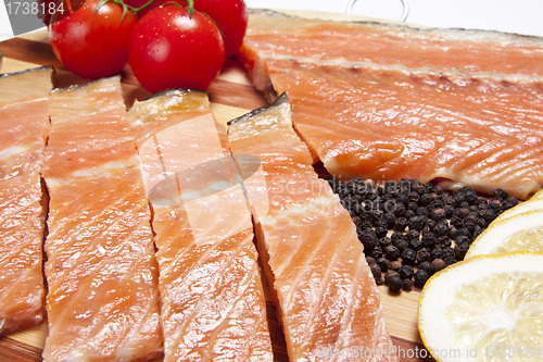 Image of close-up of smoked salmon  with tomato and pepper