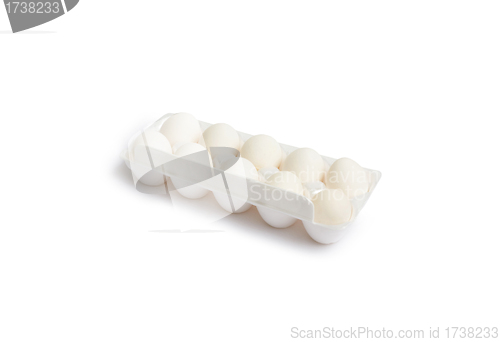 Image of Ten white eggs in a package to isolate