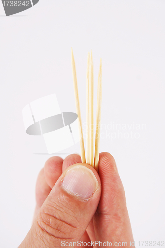 Image of toothpicks and hand