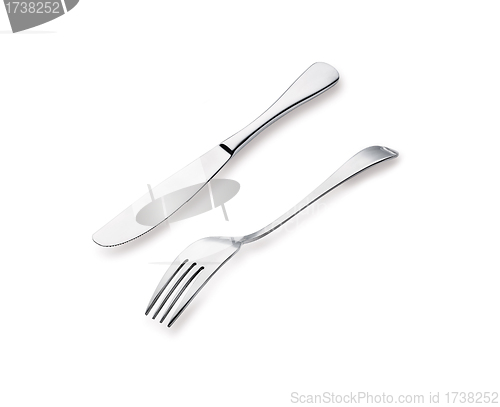 Image of Close up abstract of a silver knife and fork on a white