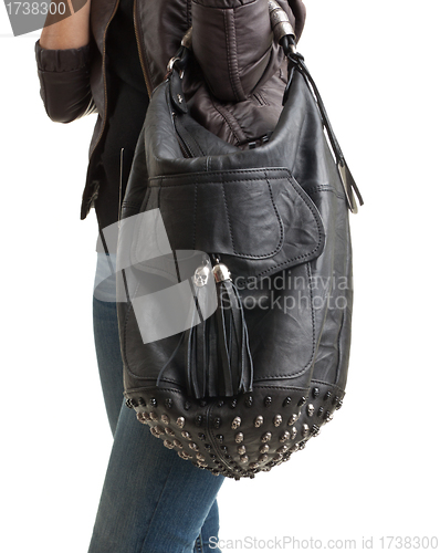 Image of girl in blue jeans with bag