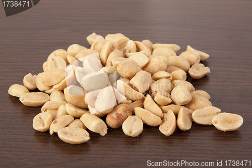 Image of Pile of Peanuts on wooden