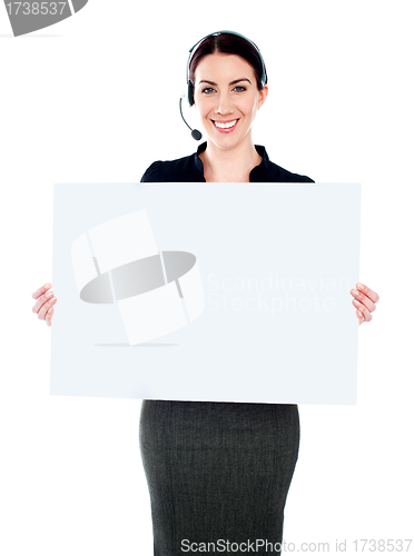 Image of Call centre executive standing with a blank billboard