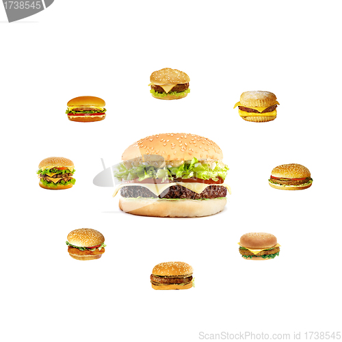 Image of nice big cheeseburger in the center hamburgers