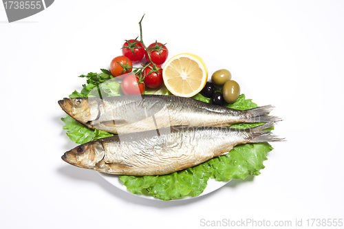 Image of Smoked sprat-appetizing snack with tomato and lemon