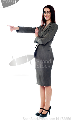 Image of Beautiful young woman pointing to the right side