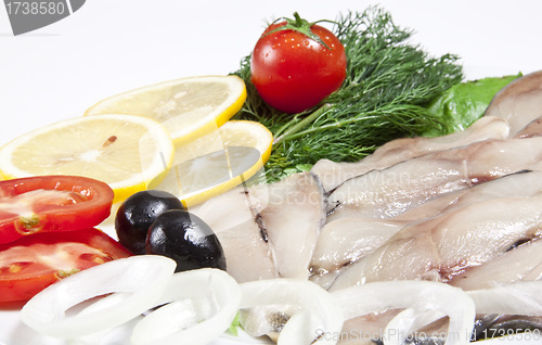 Image of macro picture of fillet herring with vegetables