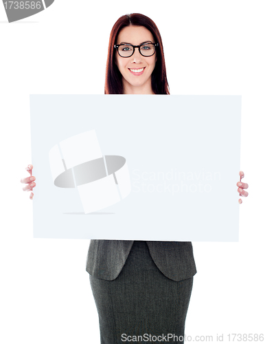 Image of Businesswoman holding a blank poster