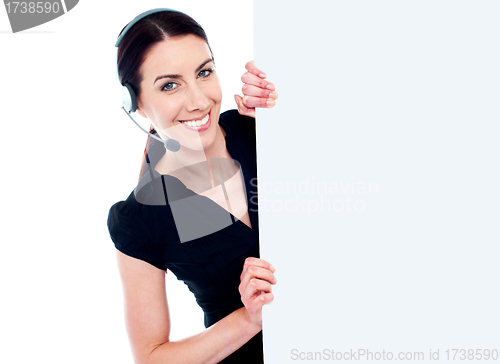 Image of Business woman with headset and banner ad