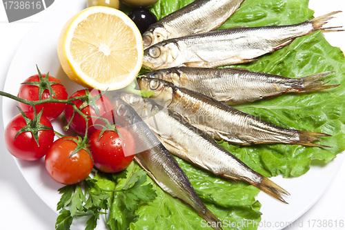 Image of smoked fish served with tomato fennel and lemon