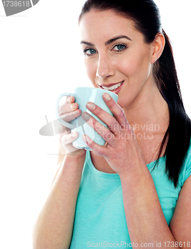 Image of Smiling girl drinking coffee