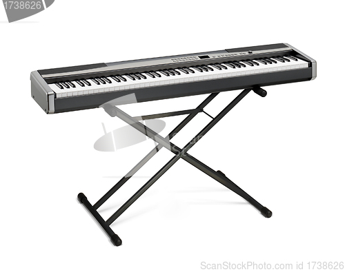 Image of Digital portable piano on stand isolated