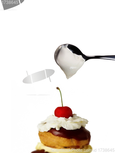 Image of cake cherry with spoon cream