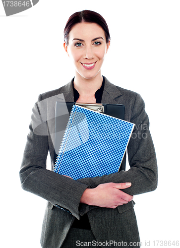Image of Corporate lady posing with clipboard and notepad