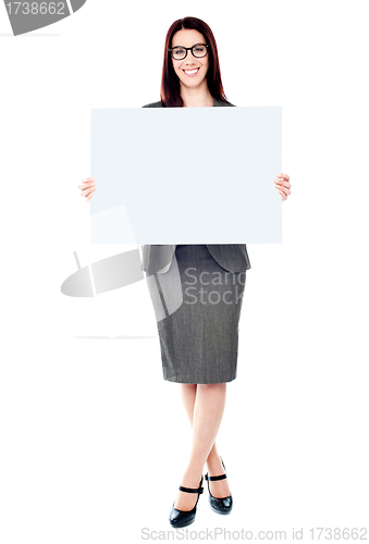 Image of Portrait of a business lady holding a blank billboard