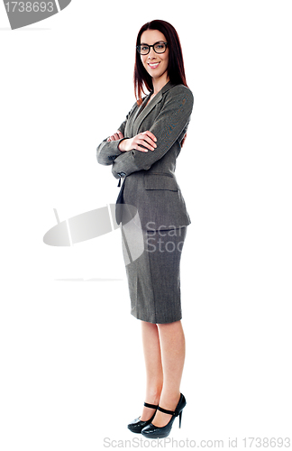 Image of Sucessful businesswoman posing with folded arms