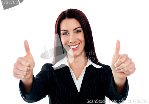 Image of Confident businesswoman showing double thumbs-up