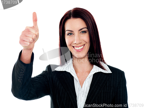 Image of Glamorous corporate lady gesturing thumbs-up
