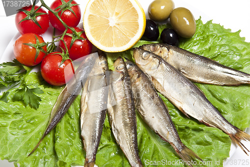 Image of smoked fish served with tomato fennel and olive