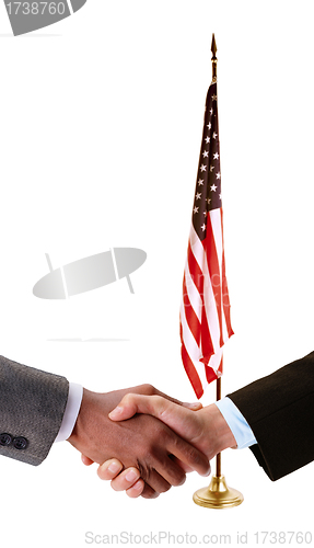 Image of hand shake and American flag